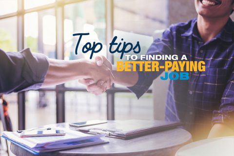 Two people shaking hands in a job interview for a better paying job