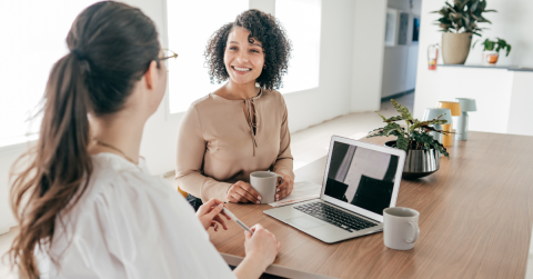 Two professional women talking