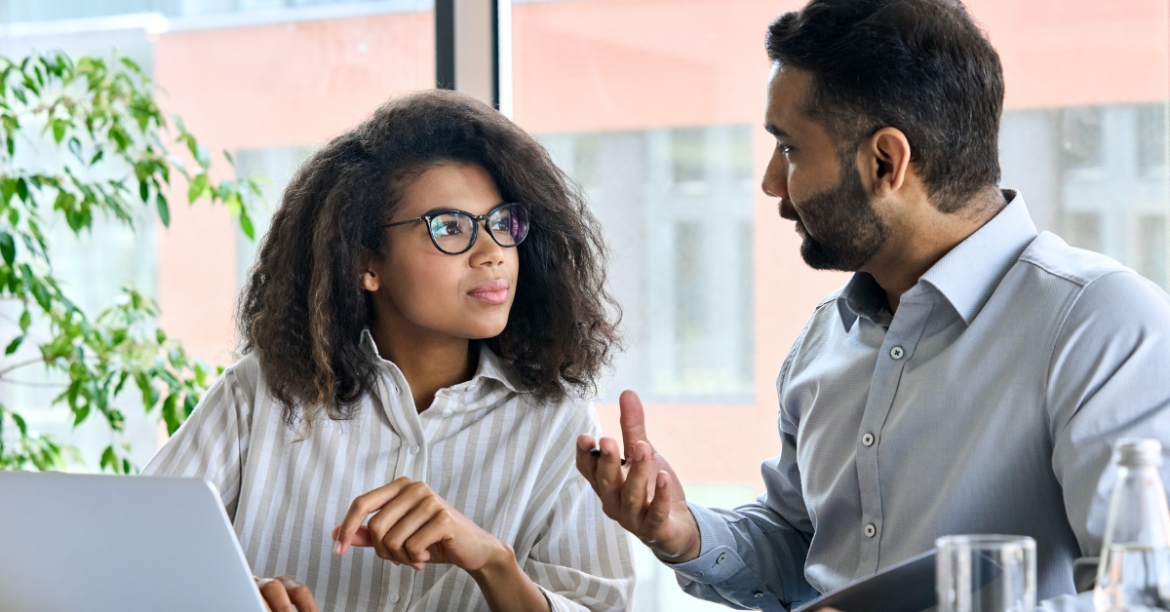 A man and woman working together as mentee and mentor