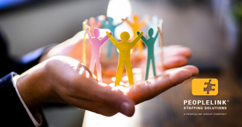hands holding colorful paper people in a circle showing leadership support
