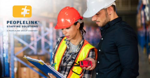 light industrial workers reviewing clipboard